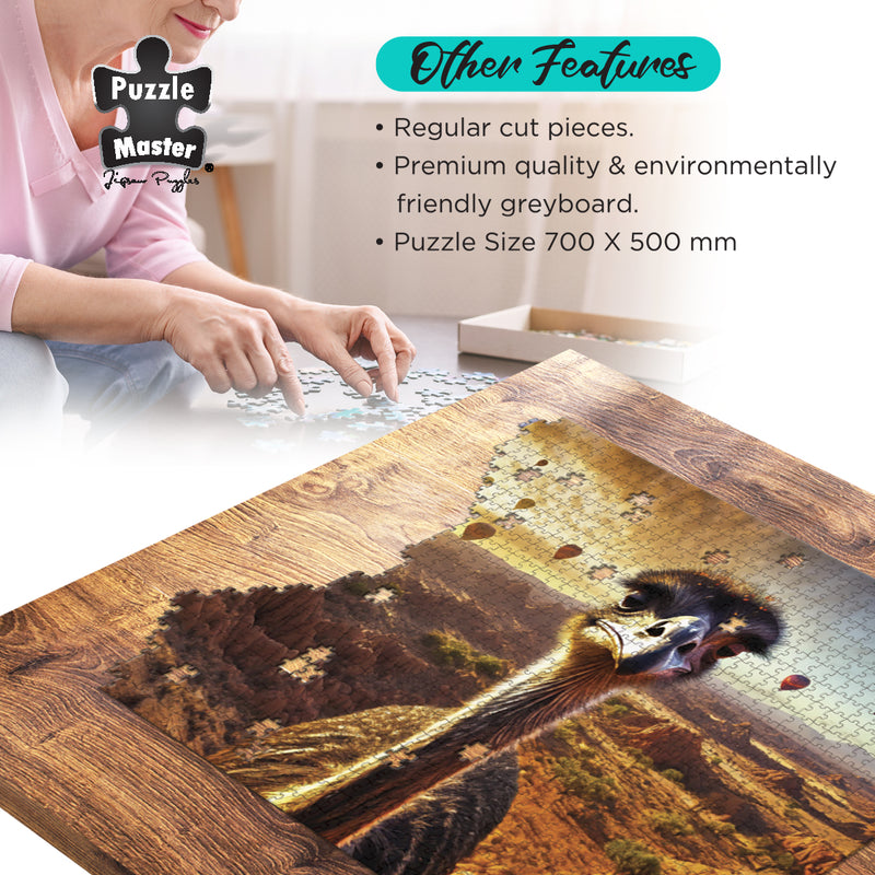 Load image into Gallery viewer, Partially completed jigsaw puzzle showing an emu in a desert setting laid on a wooden table with a person assembling pieces in the background.
